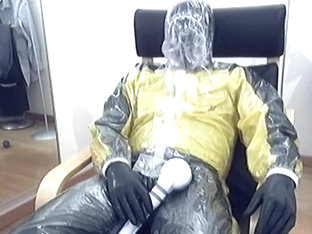 Biker in rubber and plastic at a rainy day (part 3/3)