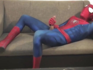 Horny Spiderman jerks off and cums massive load